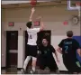  ?? SUBMITTED PHOTO — SERENA NESTER ?? Daniel Boone student Teagan Duffie attempts to score against Adam Ebling, math teacher, and Frank Flanagan, assistant principal, during the 2nd Annual Blazers BALL (Battling Against Losing Lives) basketball game to raise awareness about suicide prevention.