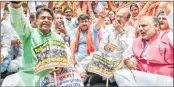 ??  ?? Delhi BJP president Manoj Tiwari with party workers raise slogans as they march towards Kejriwal's office, in New Delhi on Wednesday.