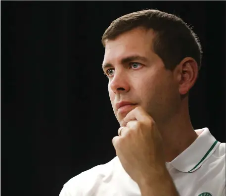  ?? NANCY LANE — BOSTON HERALD ?? Celtics president of basketball operations Brad Stevens listens to a question at the team’s Media Day on Sept. 26 in Canton. Will Stevens swing a deal or two on Thursday before the deadline?