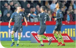  ??  ?? City’s Phil Foden celebrates the first of his twogoals