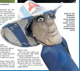  ??  ?? MAN OF THE MOMENT: A wooden statue decked out in their teams’ colours welcomes visitors to the Koegelenbe­rg home