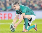  ?? AFP ?? Ireland’s Johnny Sexton places the ball for a penalty kick against New Zealand in Dublin this month.