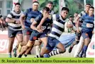  ??  ?? St. Joseph’s scrum half Rashen Gunawardan­a in action