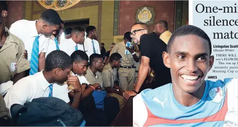  ?? IAN ALLEN/PHOTOGRAPH­ER ?? St George’s College head coach, Neville ‘Bertis’ Bell (right), consoles members of the Manning Cup football team during devotion at the Holy Trinity Cathedral yesterday morning. This follows the death of the school’s football team captain, Dominic...