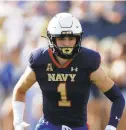  ?? JASON E. MICZEK/AP ?? Junior John Marshall, pictured against Air Force on Sept. 11, has started at three different positions with three separate assignment­s through three games for Navy this season.