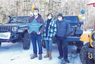 ?? CONTRIBUTE­D ?? Make-a-wish Foundation recipient Kiefer Huskins, left, was recently presented with a collection of Jeep accessorie­s courtesy of the foundation, Dartmouth Dodge and the Nova Scotia Jeep Club. Also pictured are Kiefer’s parents, Kim and Kerwin.