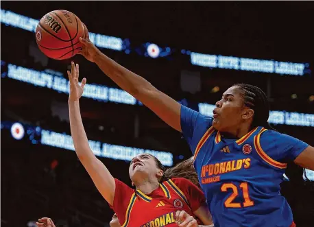  ?? Kevin M. Cox/Associated Press ?? West guard Morgan Cheli, left, is blocked by East forward Sarah Strong during the McDonald’s All American game on April 2 in Houston. Both women will play for UConn in the fall.