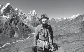  ?? Courtesy of Mike Scanlin via AP ?? Small business Nepal in 2012. owner Mike Scanlin poses for a photo on the trail to Mount Everest Base Camp in