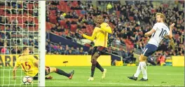  ??  ?? Tottenham Hotspur's Harry Kane (R) scores the team's second goal against Watford at Wembley Stadium.