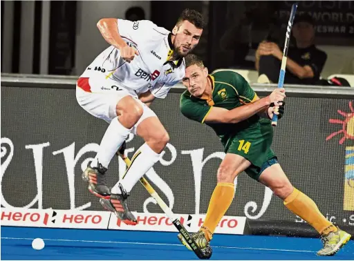  ??  ?? Hitting hard: South Africa’s Rhet Halkett (right) in action against Belgium’s Simon Gougnard during the Group C match yesterday.