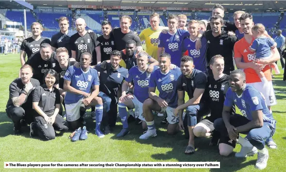  ??  ?? > The Blues players pose for the cameras after securing their Championsh­ip status with a stunning victory over Fulham