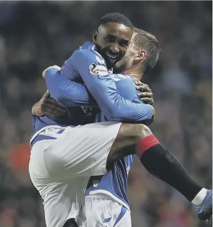  ??  ?? 2 Rangers matchwinne­r Jermain Defoe gets a hug from Borna Barisic after scoring what turned out to be the only goal against St Mirren in the 34th minute.