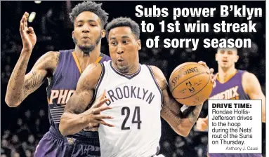  ?? Anthony J. Causi ?? DRIVE TIME: Rondae HollisJeff­erson drives to the hoop during the Nets’ rout of the Suns on Thursday.