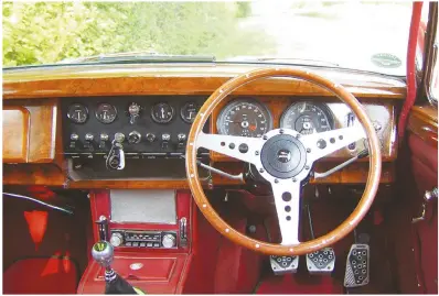  ??  ?? The 240's interior is classic ' Sixties Jaguar through and through and features plenty of veneer and leather.