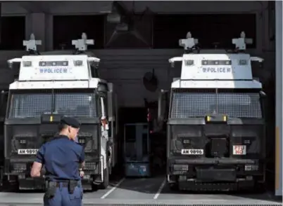  ??  ?? Police cars at the Police Tactical Unit headquarte­rs in Hong Kong. — Xinhua