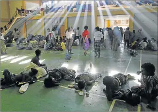  ?? Picture: REUTERS ?? TIRED AND DISTRESSED: Migrants, believed to be Muslim Rohingya from Buddhist-majority Myanmar, at a shelter in Indonesia after being rescued from boats in the northweste­rn province of Aceh. Caught off guard, authoritie­s scrambled to find food and...
