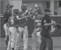  ?? The Associated Press ?? NOT TOO SHADDY: Arkansas redshirt senior Carson Shaddy (20) celebrates his second-inning, two-run home run against Ole Miss Thursday with teammates Jax Biggers (9) and Jordan McFarland (13) during the Hogs’ 6-4 road win in Oxford, Miss. Bruce Newman,...