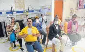  ?? HT PHOTO ?? Health workers proudly display their vaccinatio­n cards after the jabs at a centre in Prayagraj on Thursday.