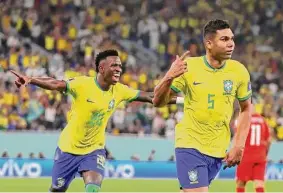  ?? Clive Brunskill/Getty Images ?? Brazil midfielder Casemiro celebrates after scoring the decisive goal in a 1-0 win Monday against Switzerlan­d to send Brazil into the next round of the World Cup.