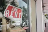  ?? LYNNE SLADKY/AP ?? A “for rent” sign hangs on a closed shop this month in Miami Beach, Fla.