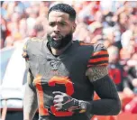  ?? RON SCHWANE THE ASSOCIATED PRESS ?? Cleveland Browns wide receiver Odell Beckham Jr. runs out on the field sporting an expensive watch, worth more than $250,000, during his debut Sunday.