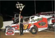  ?? RICK KEPNER — FOR DIGITAL FIRST MEDIA ?? Ray Swinehart poses in victory lane after winning the A.D. Moyer Lumber NASCAR Modified Feature at Grandview Speedway Saturday night.