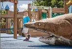  ??  ?? Lucas Lowe, 3, of Royal Palm Beach, plays at his favorite playground, the undersea-themed area at Tiger Shark Cove in Wellington.