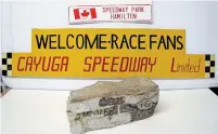  ??  ?? From Tim Miller’s collection: a sign from Hamilton’s Speedway Park, the Welcome Race Fans sign from a scale model of Cayuga Speedway and an actual clay brick from the track of the famed Indianapol­is Motor Speedway.