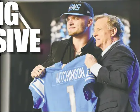  ?? USA TODAY SPORTS ?? Aidan Hutchinson, selected second overall by the Detroit Lions, poses with NFL commission­er Roger Goodell at last night's draft.