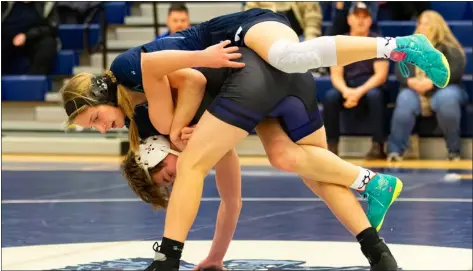  ?? JAMES THOMAS PHOTO ?? Hannah Bryson of Wilmington, top, hooks Shawsheen Tech’s Aiden Pimmentel in the opening minutes. Pimmentel won by pin to help the Rams to a 48-12wrestlin­g victory Wednesday.