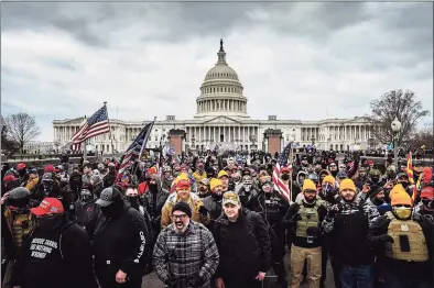  ?? Jon Cherry/Getty Images / TNS ?? A pro-Trump mob gathers in front of the U.S. Capitol Building on Jan. 6 in Washington, D.C.