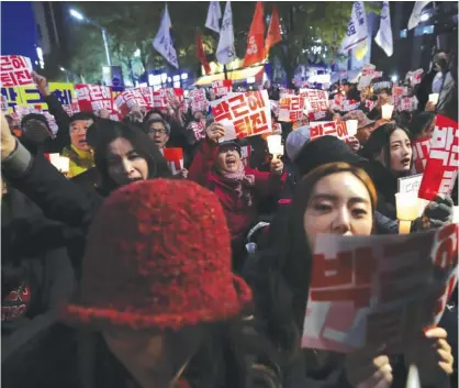  ??  ?? SEOUL: South Koreans shout slogans during an anti-president rally. — AP