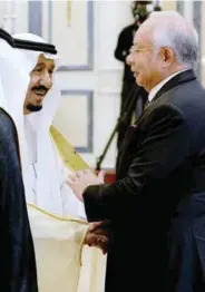  ??  ?? Najib is welcomed by King Salman during the summit in Riyadh yesterday.