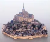  ?? ASSOCIATED PRESS ?? In March 2015, a high tide submerges a narrow causeway leading to the Mont Saint-Michel, on France’s northern coast.