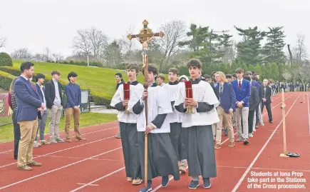  ?? ?? Students at Iona Prep take part in the Stations of the Cross procession.