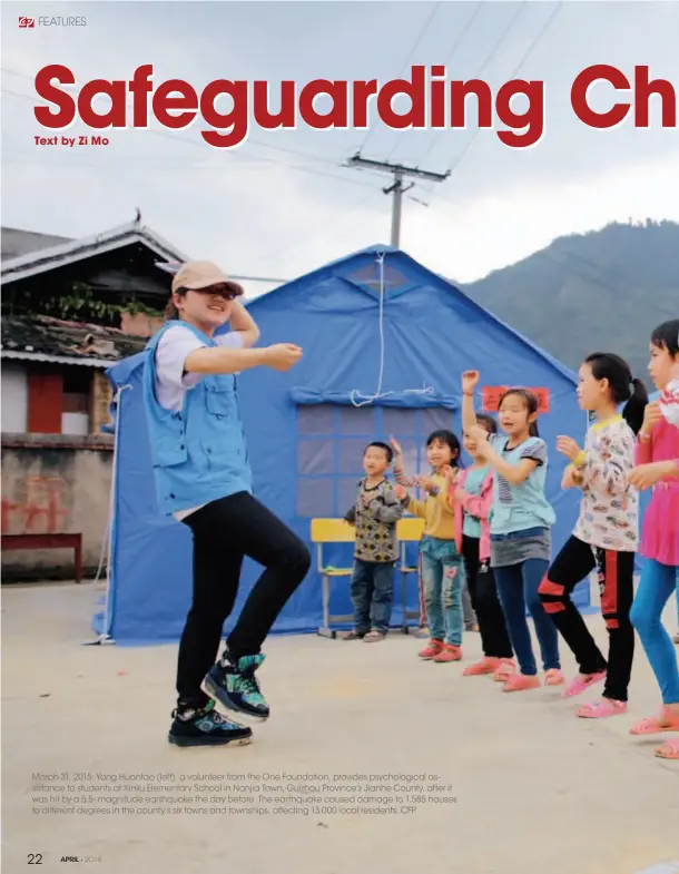  ??  ?? March 31, 2015: Yang Huantao (left), a volunteer from the One Foundation, provides psychologi­cal assistance to students at Xinliu Elementary School in Nanjia Town, Guizhou Province's Jianhe County, after it was hit by a 5.5- magnitude earthquake the...