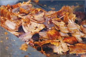  ?? The Associated Press ?? Slices of meat carved from a rotisserie Doner spit in Frankfurt, Germany will be put into a sandwich that’s popular with millions of Europeans. Proposed European Union health rules threaten the future of the favourite food.