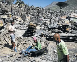  ?? /The Times ?? Remnants: A small part of the devastatio­n caused by the fire that ravaged Imizamo Yethu in Hout Bay.