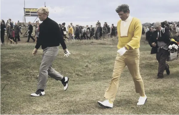  ??  ?? 0 Doug Sanders, right, whose missed putt at the 72nd hole cost him the Open, with eventual winner Jack Nicklaus during their play-off in 1970.