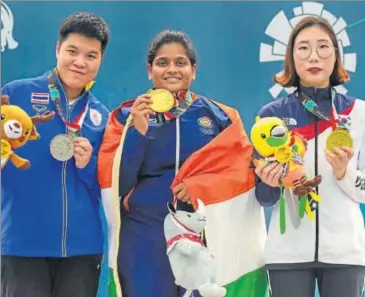  ?? PTI ?? Indian shooter Rahi Sarnobat on the podium after winning gold in women’s 25m pistol at the Asian Games.