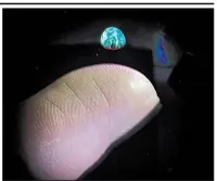  ?? AP/DAN SMALLEY LAB, BRIGHAM YOUNG UNIVERSITY ?? An image of the earth is projected above a fingertip by Brigham Young University scientists in Provo, Utah, recently.