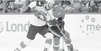  ?? SEAN KILPATRICK/AP ?? Ottawa Senators' Dion Phaneuf (2) keeps the puck from Florida Panthers' Derek MacKenzie during the first period.