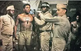  ?? Columbia Pictures / Photofest ?? RETITLED “A Soldier’s Story,” Charles Fuller’s play was made into a 1984 movie with key actors Art Evans, left, Larry Riley, second from left, and Adolph Caesar.