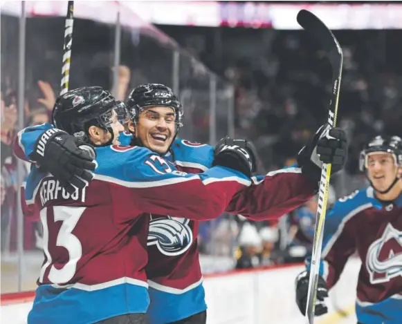  ?? John Leyba, The Denver Post ?? Avalanche center Alexander Kerfoot, left, celebrates his goal with right winger Nail Yakupov in the first period against the Bruins on Wednesday at the Pepsi Center. Yakupov later scored his third goal of the season in Colorado’s 6-3 victory over Boston.