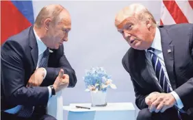  ?? EVAN VUCCI/AP ?? President Donald Trump met with Russian President Vladimir Putin on the sidelines of the G-20 summit in Hamburg, Germany, last July. Next Monday in Helsinki the two will meet for their first formal meetings.