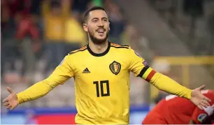  ?? — AFP ?? Belgium’s eden hazard celebrates after scoring a goal against russia.