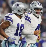  ?? GETTY IMAGES FILE ?? Cowboys receiver Amari Cooper, left, and quarterbac­k Dak Prescott have been tough to stop this season.