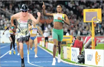  ??  ?? Ben shows Caster how to roll over the line to grab gold in the 800m world athletics championsh­ips.