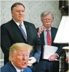 ?? NEW YORK TIMES FILE PHOTO ?? Secretary of State Mike Pompeo, left, and John Bolton, President Donald Trump’s national security adviser, look on as the president speaks to reporters in June in the Oval Office. Trump fired Bolton, his third national security adviser, Tuesday.