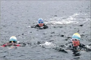  ??  ?? IN THE SWIM: Brave swimmers took on the cold waters of Loch Leven for the Glencoe open water
swim at the weekend